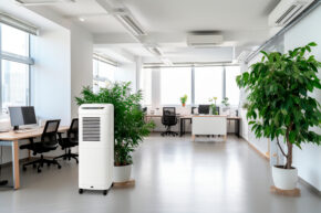 Portable mobile air conditioner in office interior.